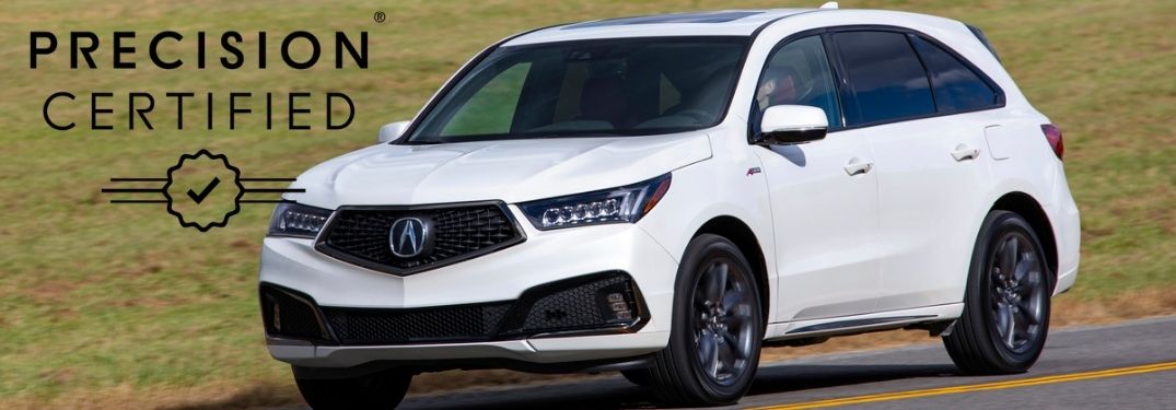 White 2019 Acura MDX on a Country Road with Black Acura Precision Certified Logo
