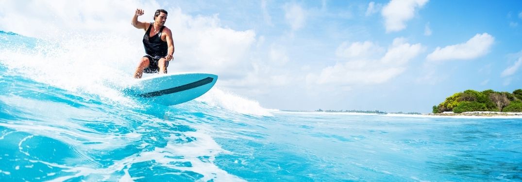 Man surfing through waves