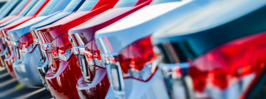 Line of parked cars in a car lot