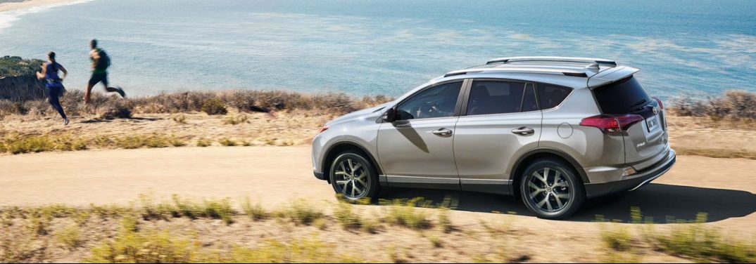 2018 Toyota RAV4 full view driving by some water