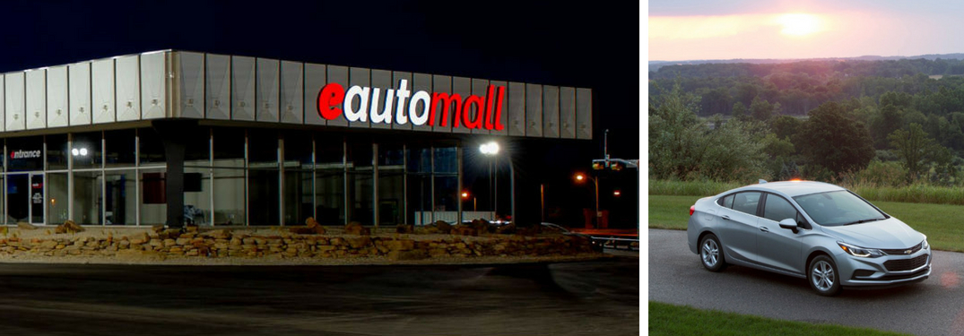 e Auto Mall Dealership Sign at Night and Silver 2017 Chevy Cruze on a Country Road at Dusk