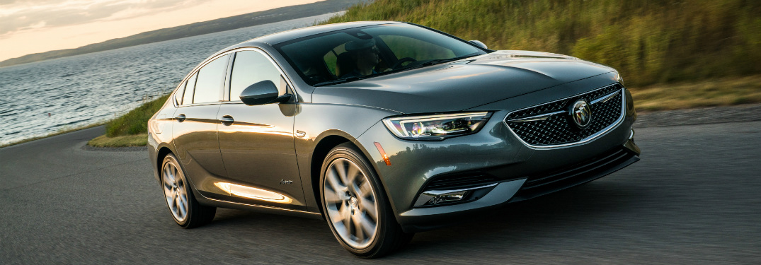 2019 Buick Avenir driving along a curved road by the ocean coast