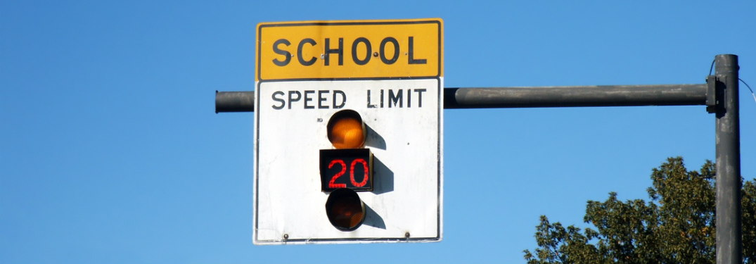 school zone speed limit sign with 20 mph speed limit