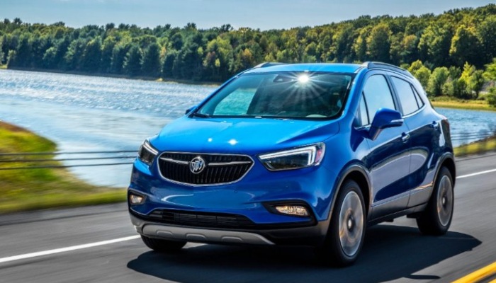 2019 Buick Encore driving near a lake.