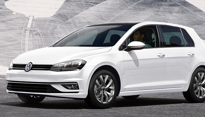 2019 Volkswagen Golf S parked in front of a mural