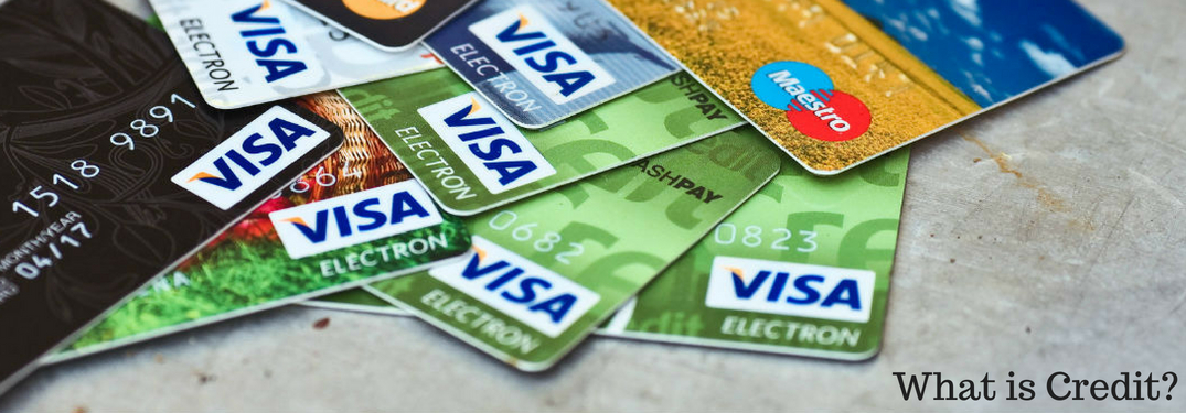 What is Credit?, text on an image of credit cards strewn atop a table