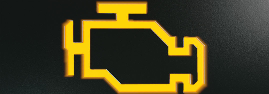 orange check engine light on black background