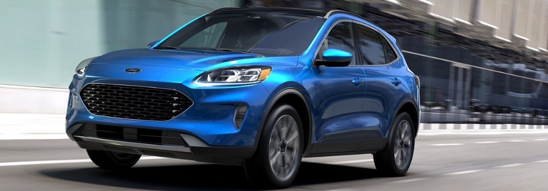2020 Ford Escape driving down city street from exterior front drivers side