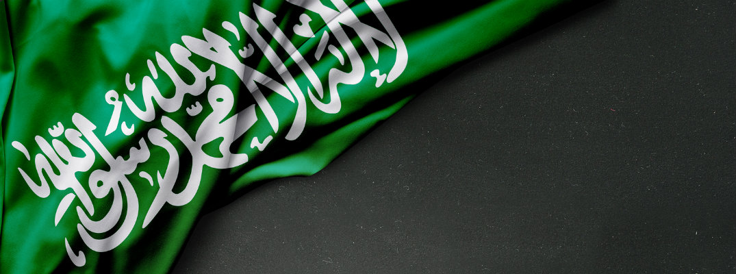 Folded flag of Saudi Arabia on black background
