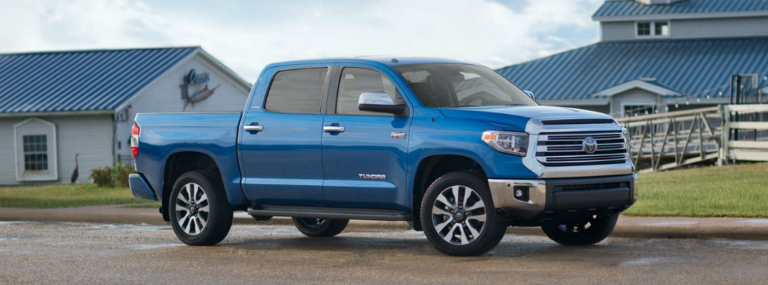 Blue 2018 Toyota Tundra parked in front of barn