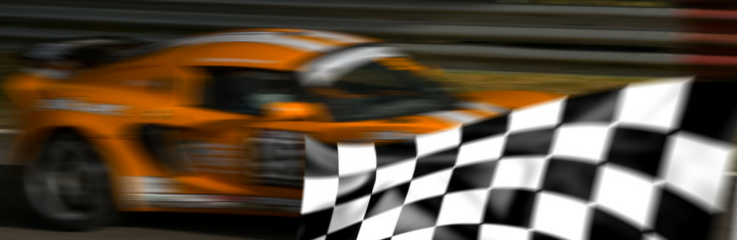 generic race car speeding by a checkered flag