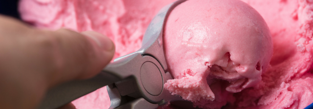 strawberry ice cream being scooped