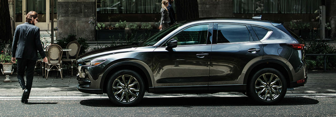 2020 Mazda CX-5 exterior driver side man in suit walking past front fascia
