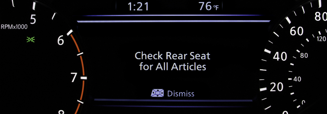 nissan rear door alert technology notification on driver's dashboard