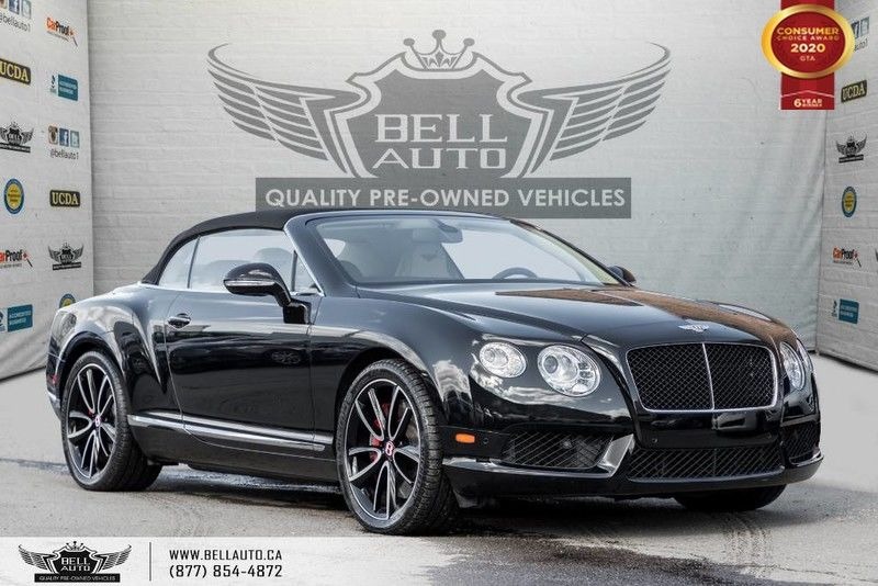 Exterior view of a black Bentley Continental in the Bell Auto Inc showroom