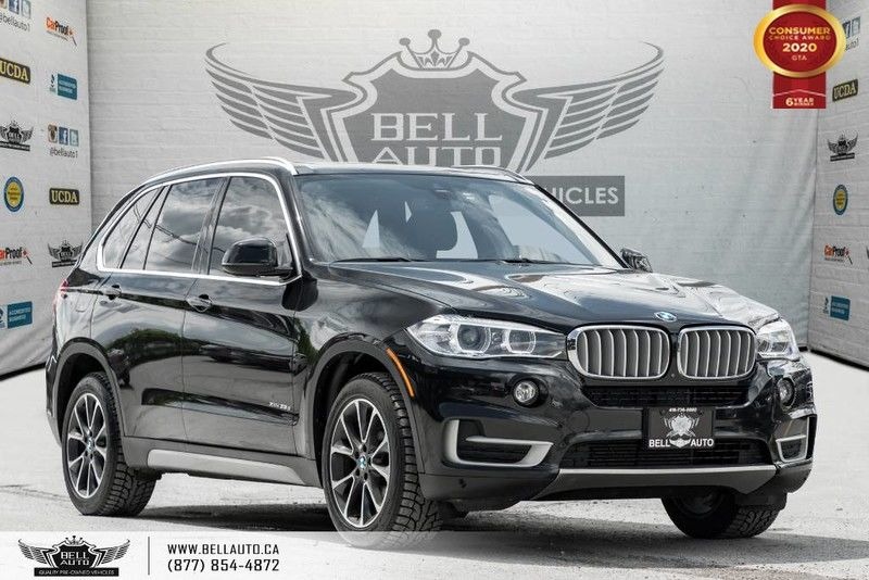 Exterior view of a black 2016 BMW X5 xDrive35 in the Bell Auto Inc showroom