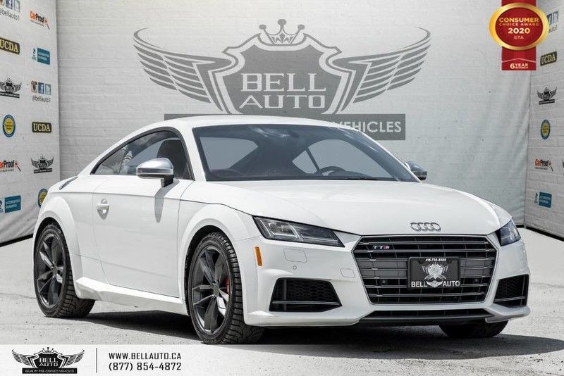 Exterior view of a white 2018 Audi TTS Coupe Quattro in the Bell Auto Inc showroom