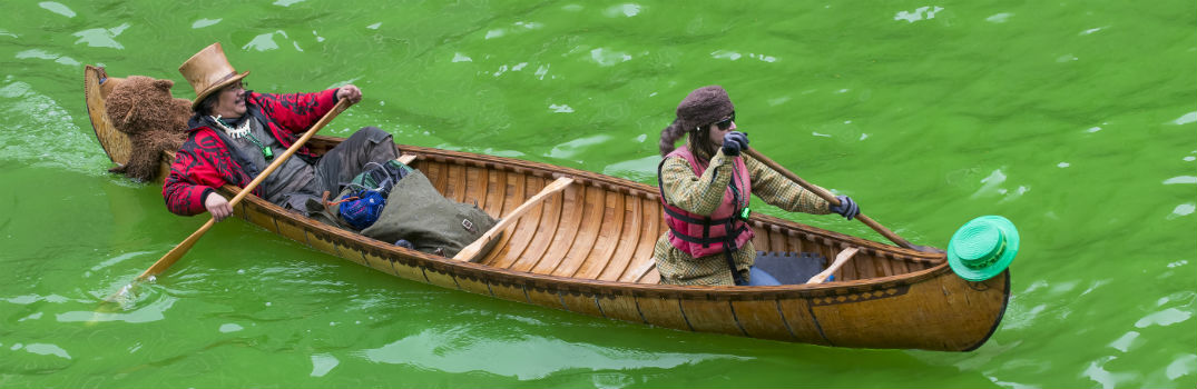 two people canoeing down green river