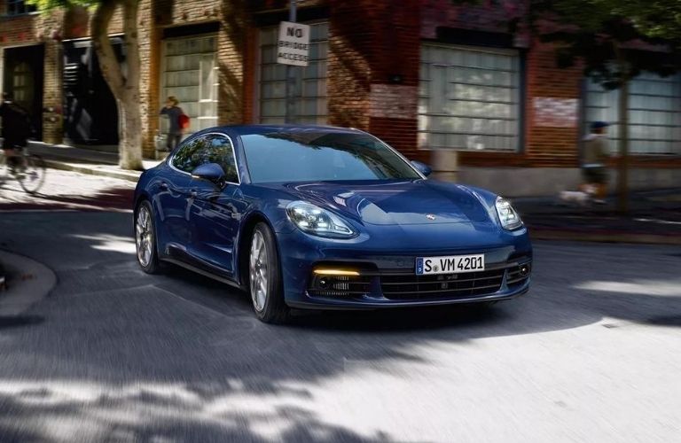 Exterior view of the front of a blue 2020 Porsche Panamera