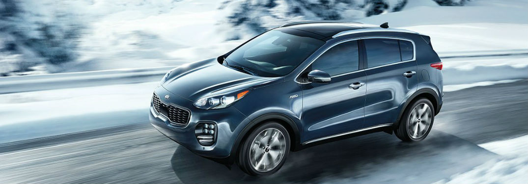 Kia Sportage driving a road