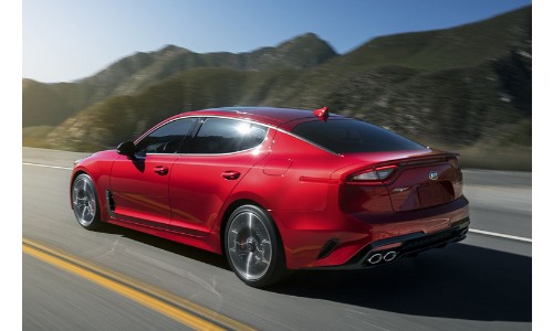 2019 Kia Stinger exterior front fascia driver side on highway with mountains