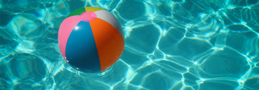Beach ball floating in a pool