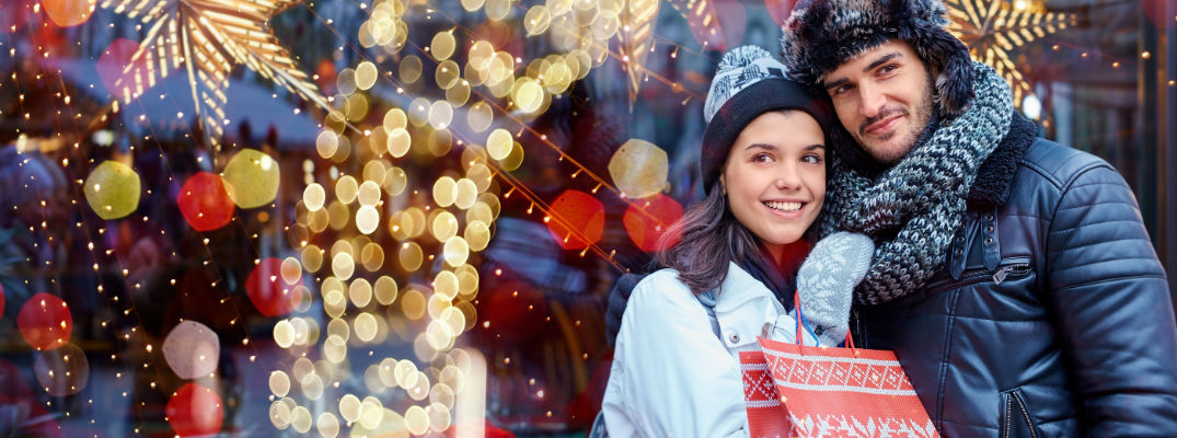 A stock photo of people out Christmas shopping.