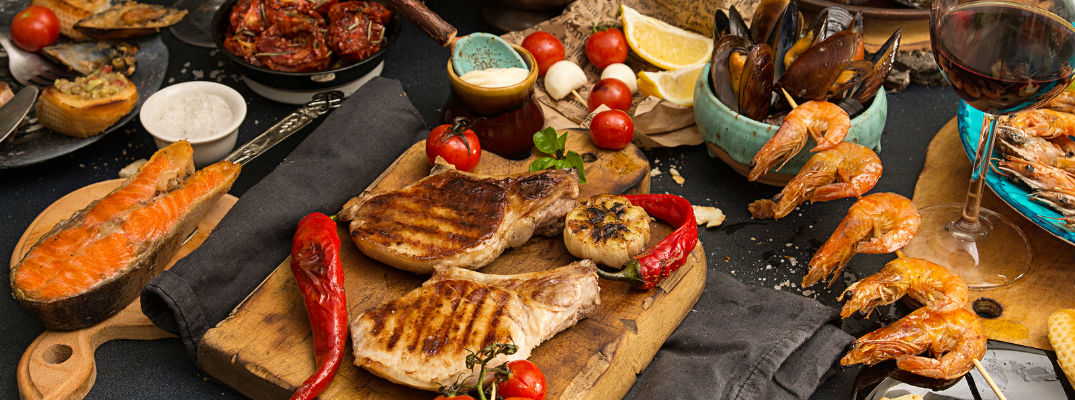 A photo of a table filled with various kinds of food.