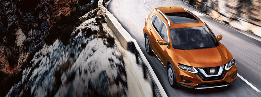 Orange 2020 Nissan Rogue on the road