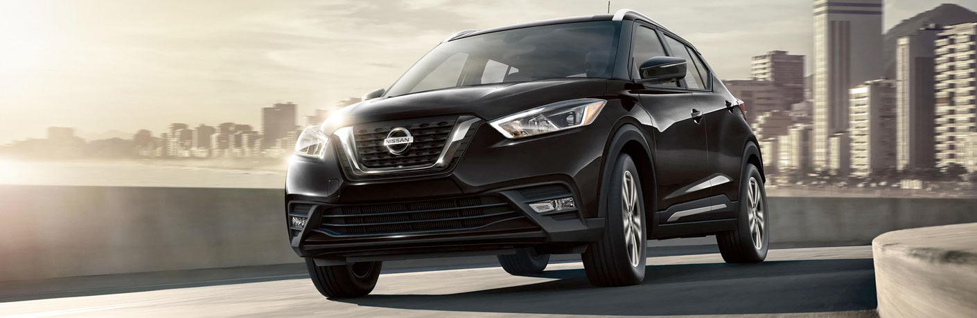 Front view of black 2020 Nissan Kicks on city road
