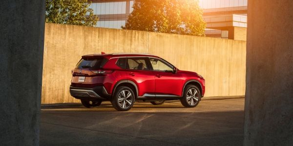 Red 2021 Nissan Rogue Rear Exterior on a Freeway