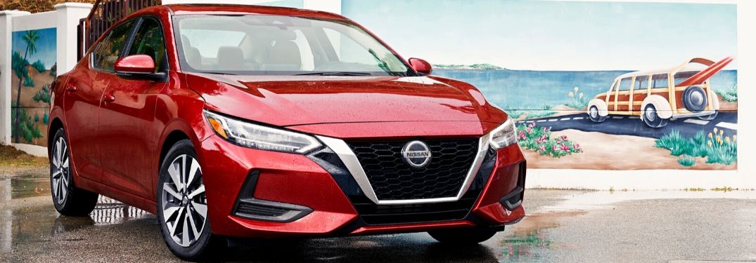 Red 2020 Nissan Sentra in Front of Beachfront Mural