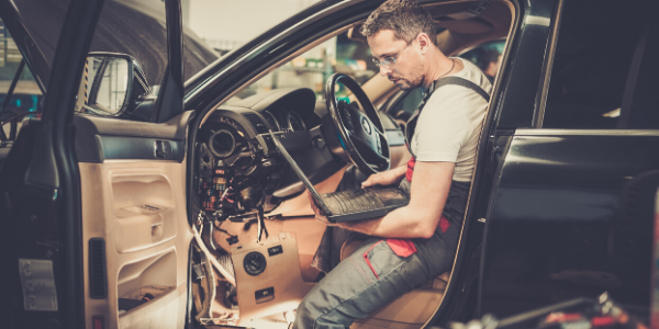 Mechanic working in vehicle
