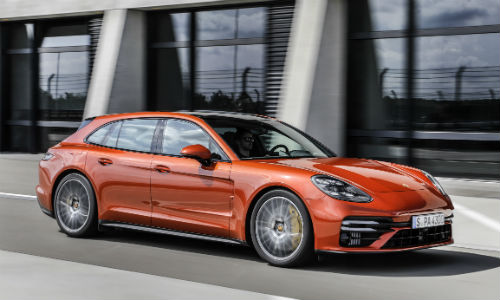 Side view of orange 2021 Porsche Panamera