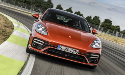 Front view of orange 2021 Porsche Panamera