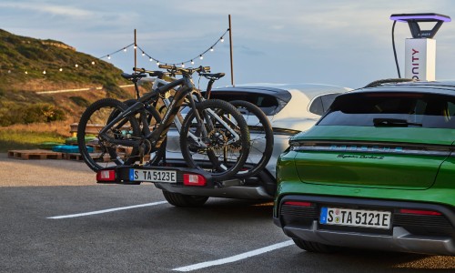 White 2021 Porsche Taycan Cross Turismo with bikes on back
