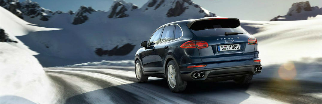 Porsche SUV driving on a winter road