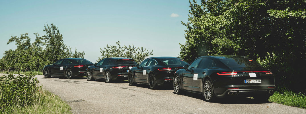 A line of 2020 Porsche Panamera models waiting to get on the test track.