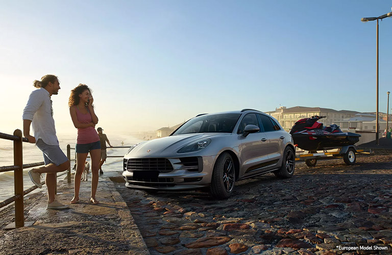 2020 Porsche Macan at the beach with its humans