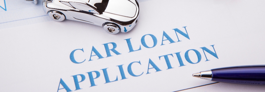 Car loan application with little car and pen