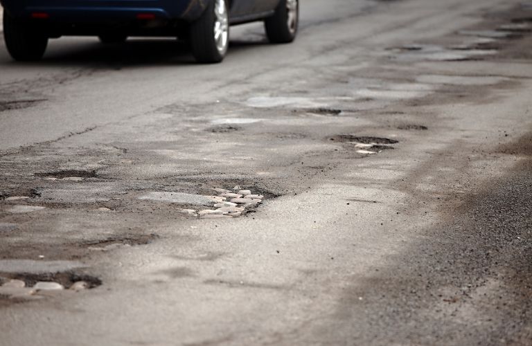 Potholes on a road