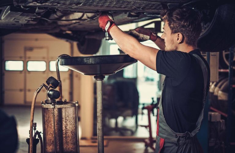 Mechanic performing the transmission flush service