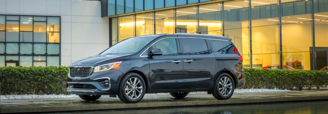 side view of a black 2020 Kia Sedona
