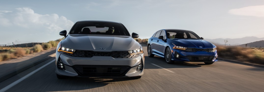 two 2021 Kia K5 sedans