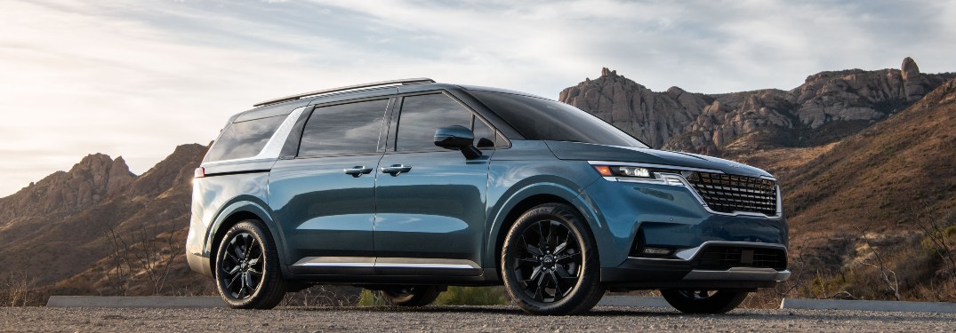 side view of a blue 2022 Kia Carnival