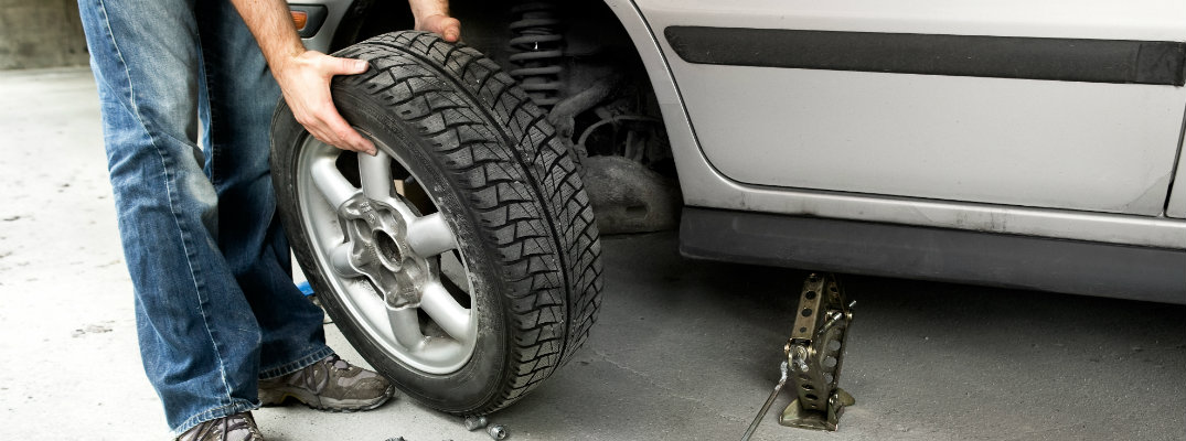 Tire being changed on a car