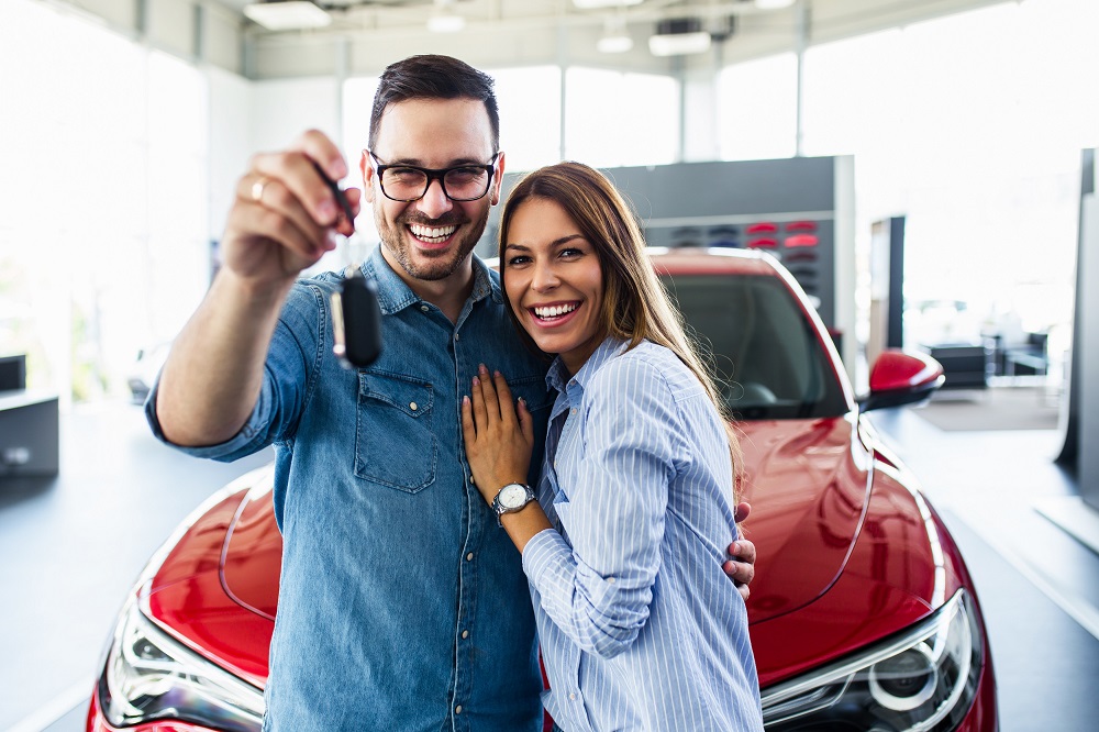 Couple with their new car