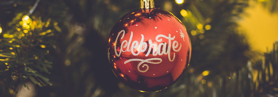 red ornament with celebrate text