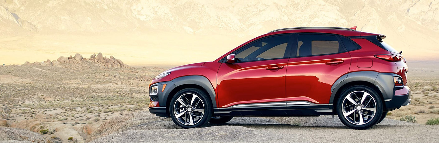 red hyundai kona side view