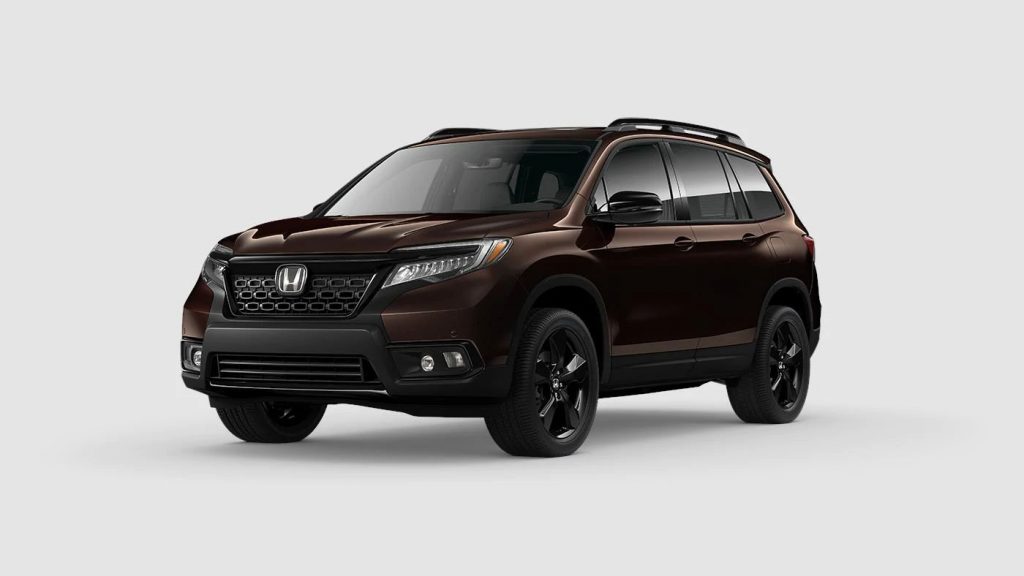 Black Copper Pearl 2020 Honda Passport on Gray Background